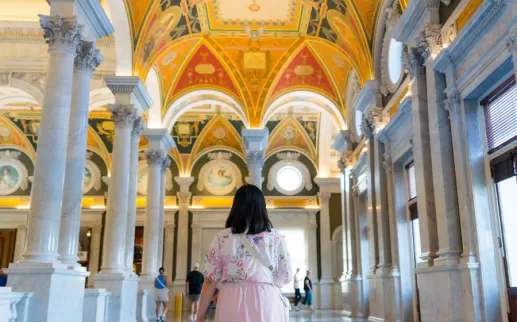 Person standing inside the Library Of Congress
