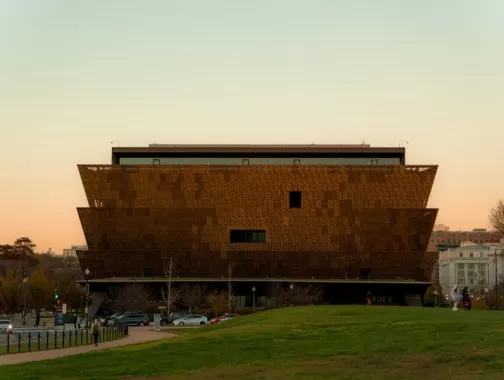 The National Museum of African American History and Culture in Washington, DC, at sunset.