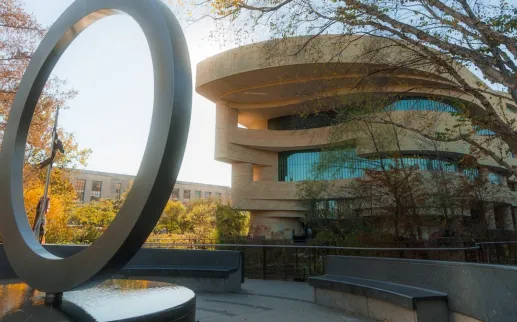The National Native American Memorial with the National Museum of the American Indian behind
